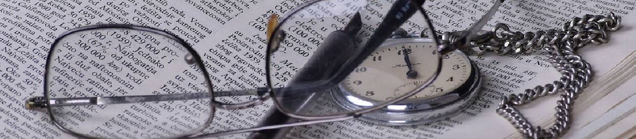 Panarama image of glasses and pocket watch at top of Research page